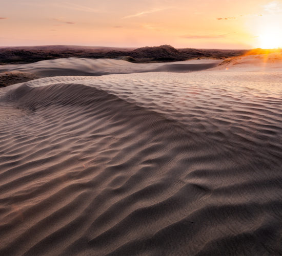 The sun sets on the landscape at the Great Sandhills, Saskatchewan.