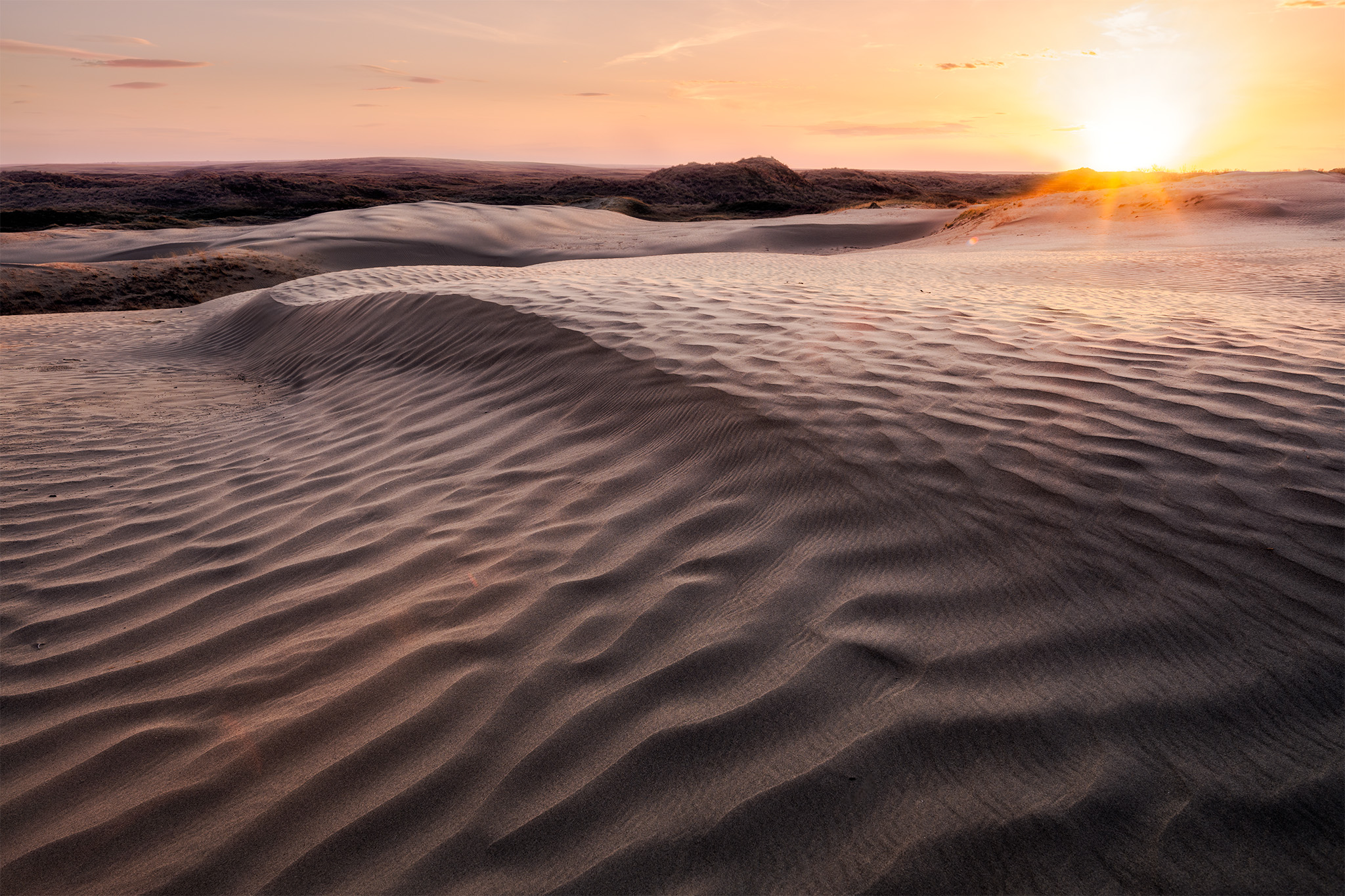 The sun sets on the landscape at the Great Sandhills, Saskatchewan.