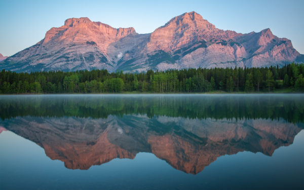 A landscape photograph of sunrise Wedge Pond Alberta.