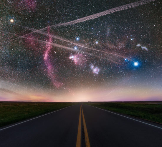 Landscape astrophotography in Saskatchewan of the Orion constellation over a road