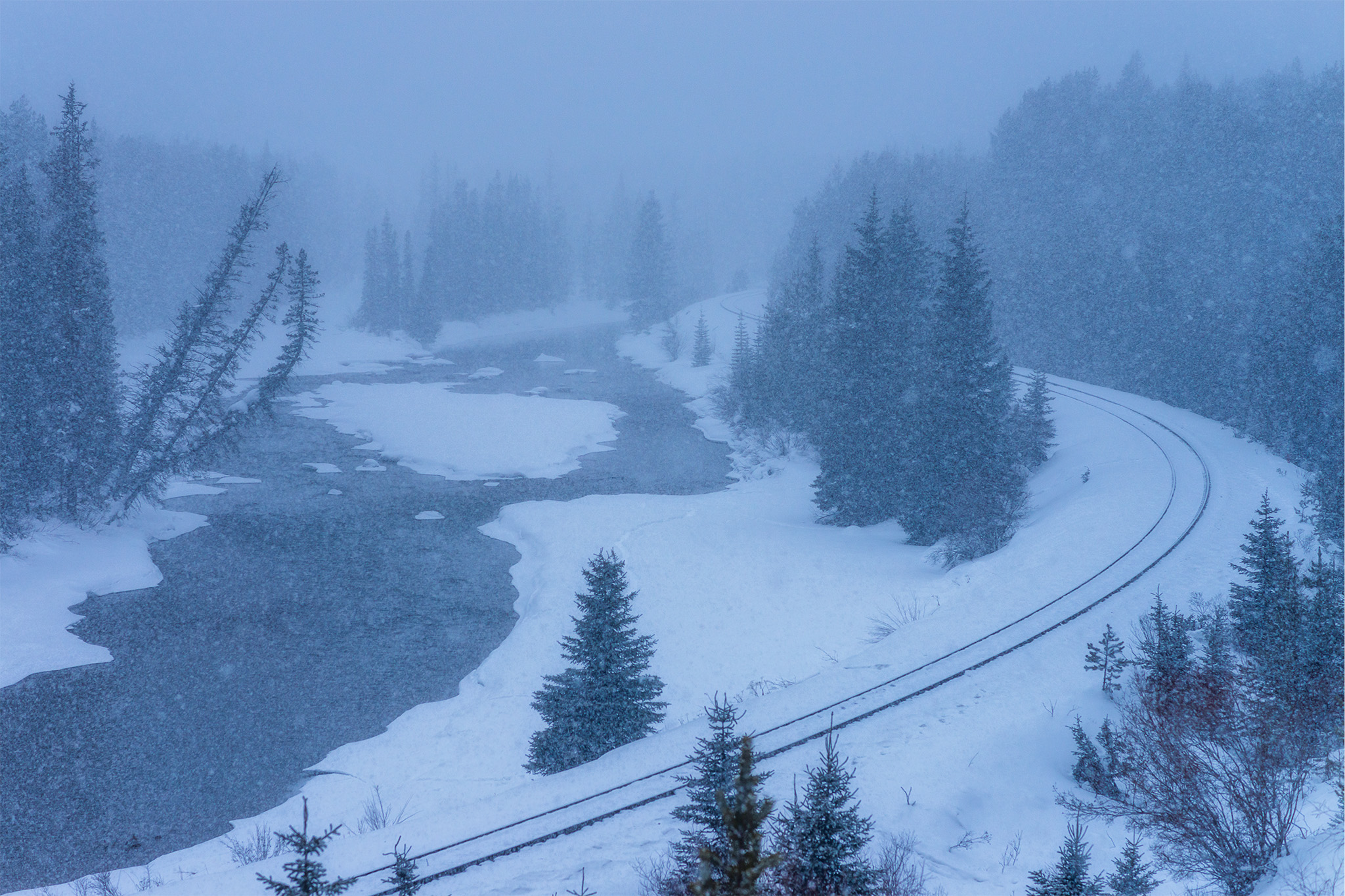 Landscape Photography in a snowstorm at Morant's Curve in the Canadian Rockies, Alberta.