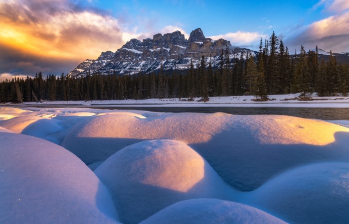 Landscape Photography in the Canadian Rockies. A photo of Castle Mountain taken during a Marc Adamus workshop. Snow pillows and morning light in the foreground.