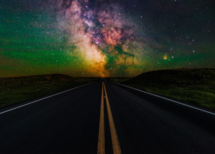 Night photography of the highway to Val Marie with the milky way aligned in the center