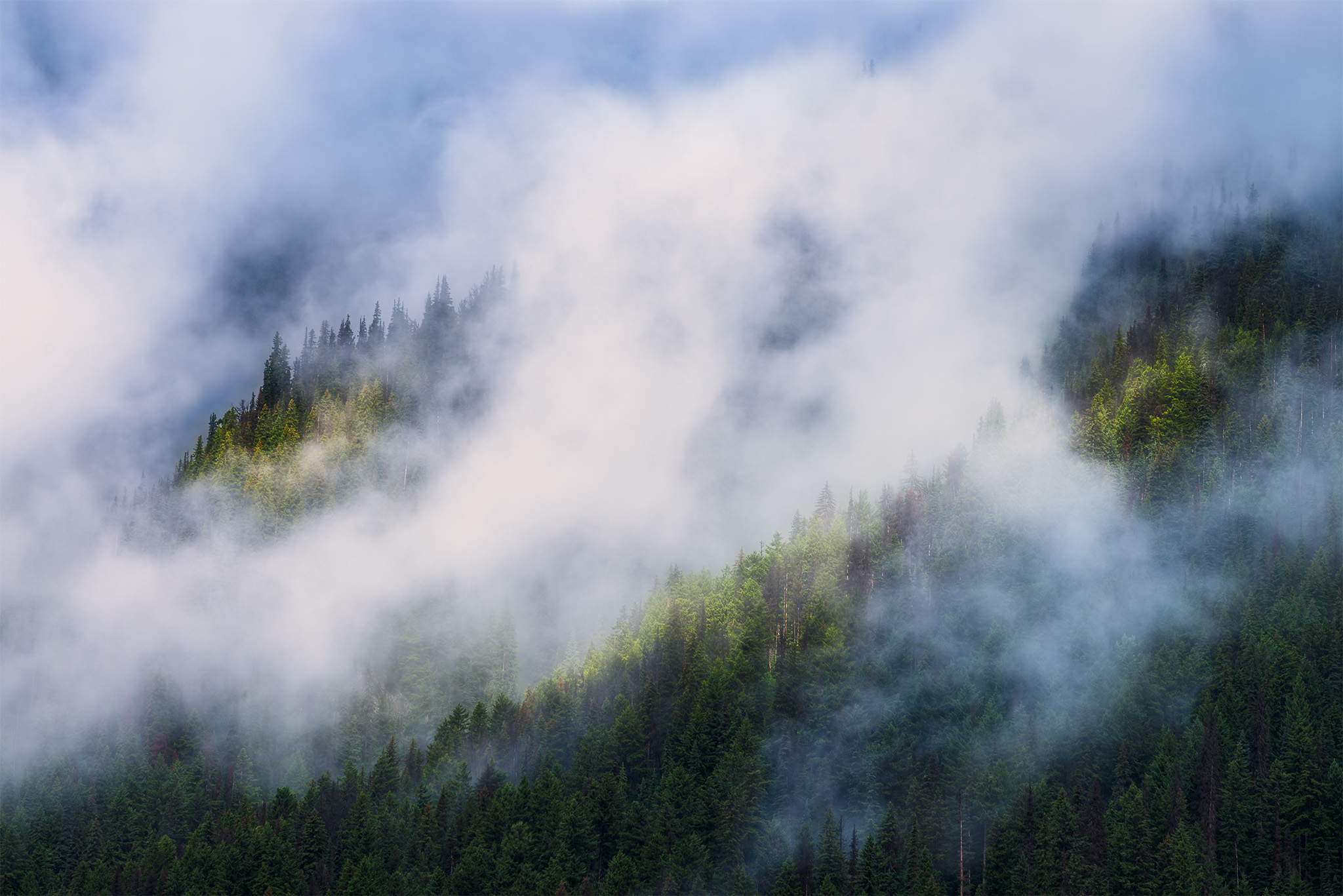 Intimate landscape photography of light hitting the side of a mountain in British Columbia