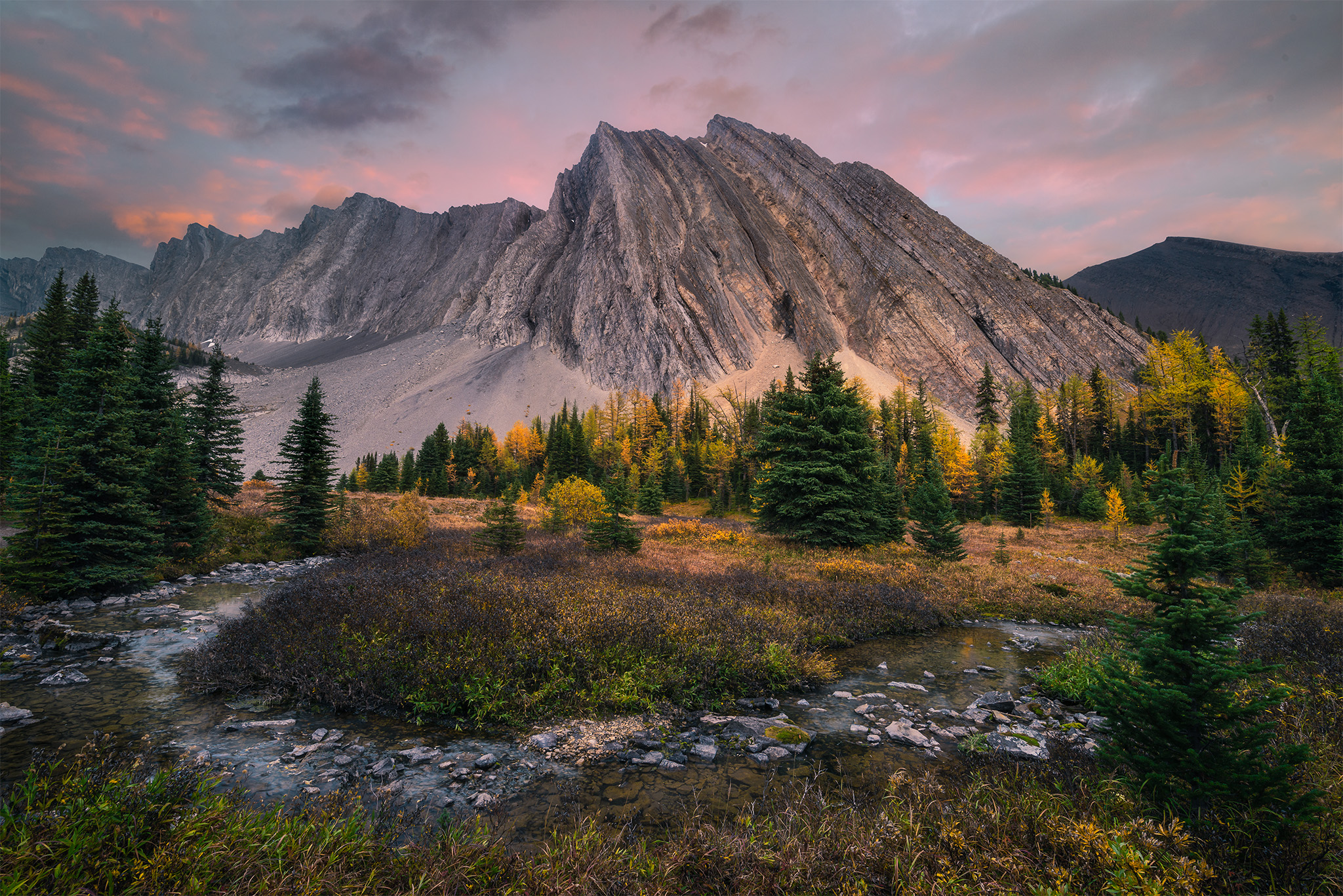 A landscape photograph captured at Chester Lake in the Canadian Rockies at sunset
