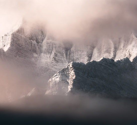 A landscape photograph of Castle Mountain in the Canadian Rockies under morning light