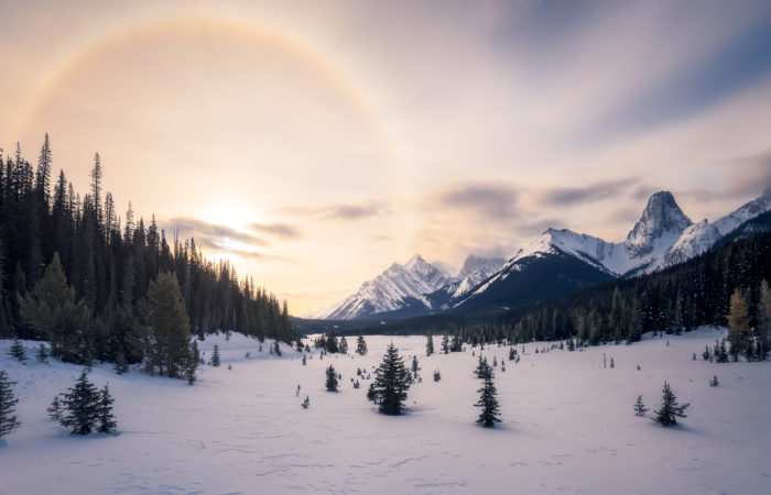 Landscape photography of a sun halo in the Canadian Rockies during winter