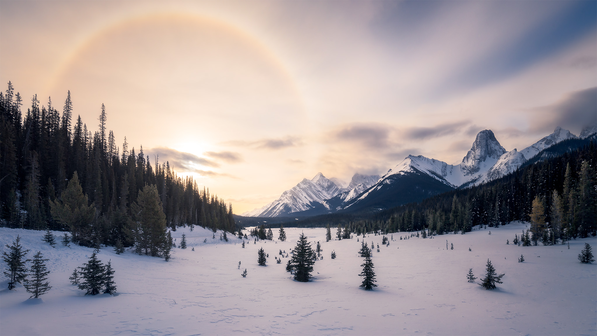 Landscape photography of a sun halo in the Canadian Rockies during winter