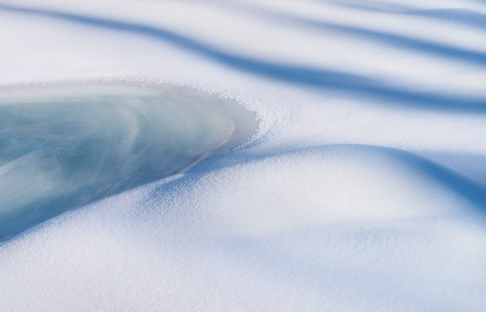 An abstract landscape photograph of the river near Natural Bridge in the Canadian Rockies