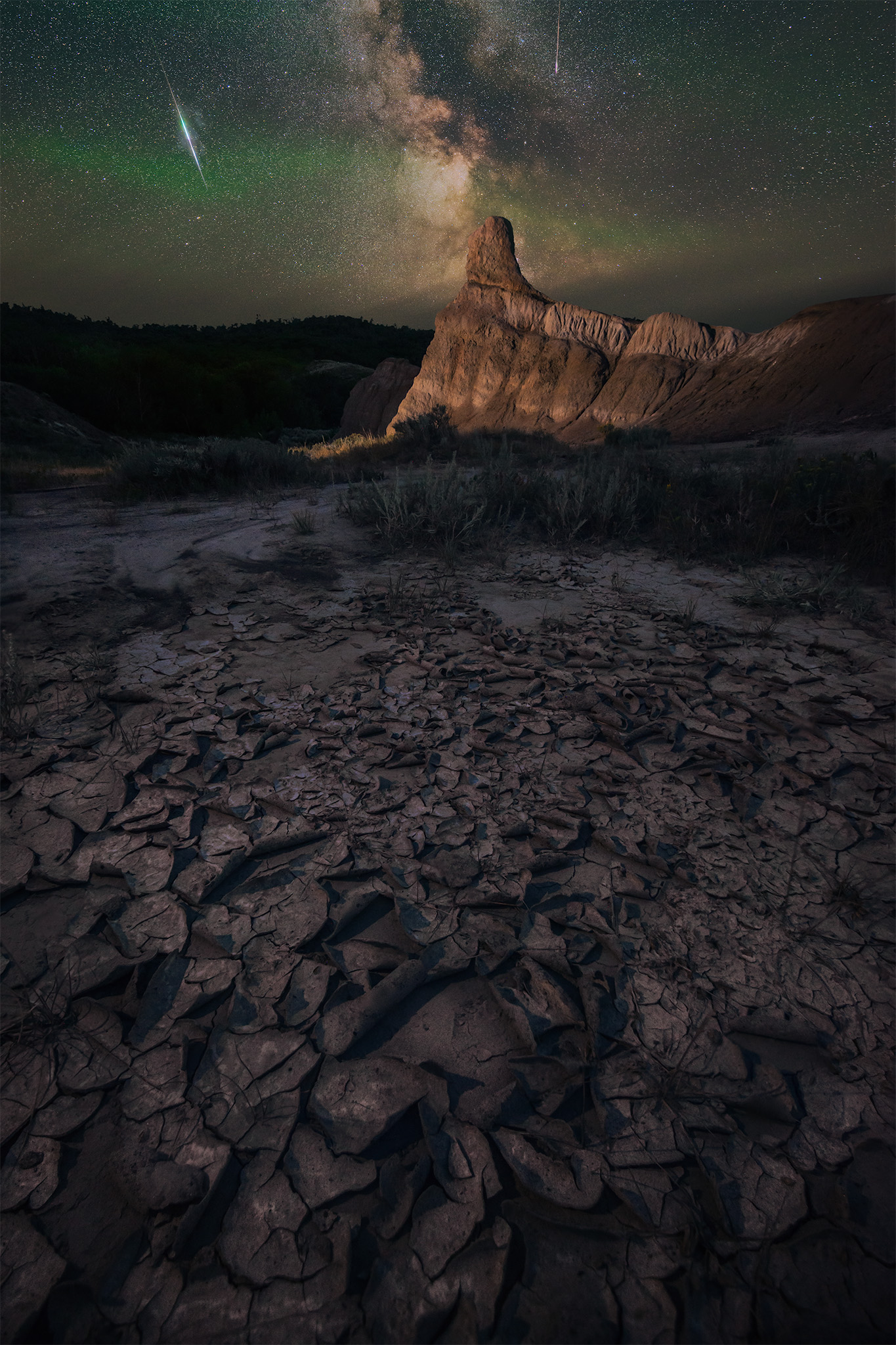 A night photograph of a hoodoo and the milky way during the Perseid meteor shower