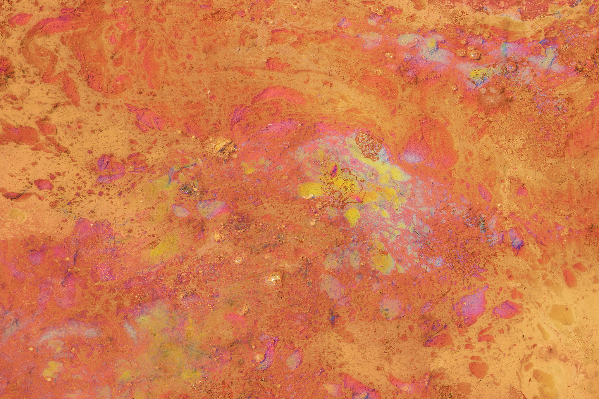 An abstract photograph of natural oils in a pool at the Paint Pots in Kootenay National Park
