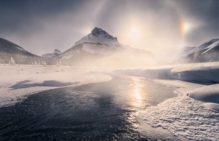 A landscape photograph of Tangle Ridge in the Canadian Rockies during winter