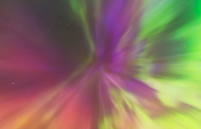 An aurora borealis explosion overhead called carona