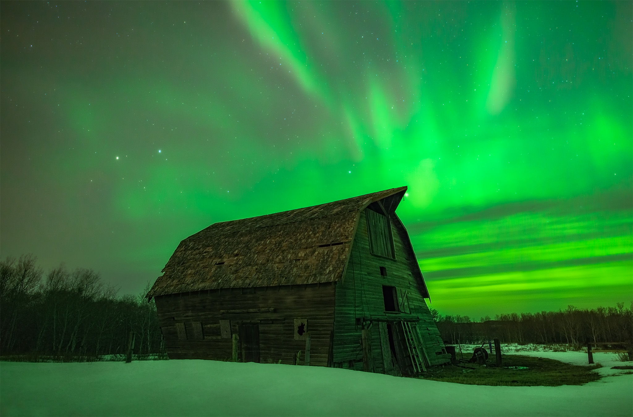 Aurora borealis over an old barn in Saskatchewan