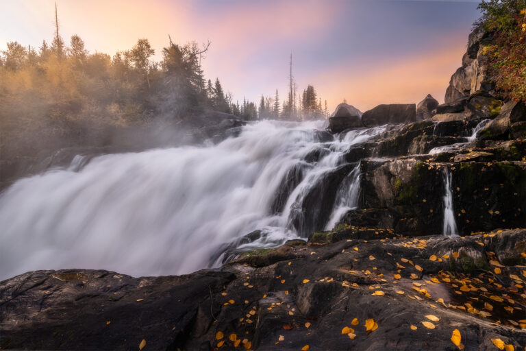 A sunrise photograph of Nistowiak Falls in northern Saskatchewan