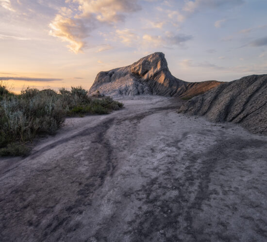 A landsacape photograph of a hoodoo at sunset in Saskatchewan