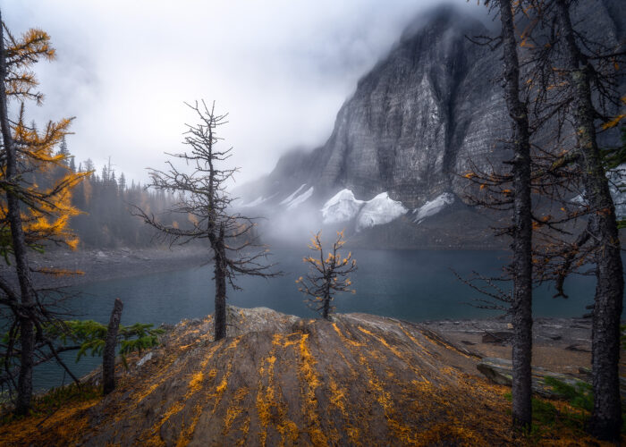 A landscape photograph of Floe Lake in Kootenay National Park on a foggy morning