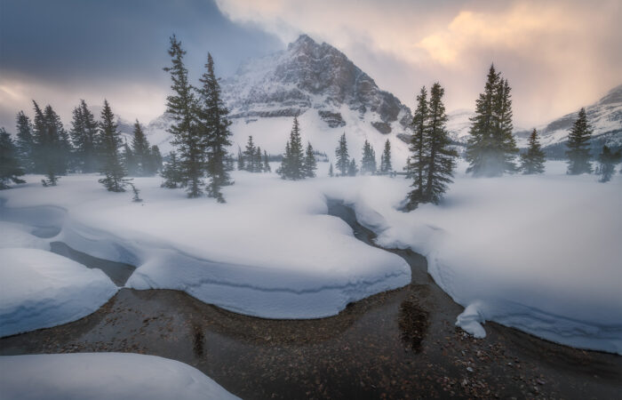 Blowing snow at Bow Lake in the Canadian Rockies featuring Crowfoot Mountain
