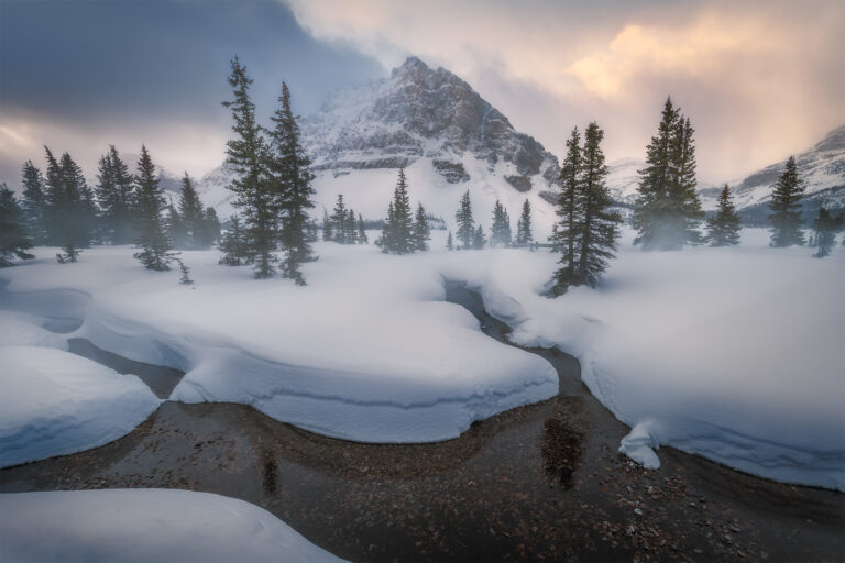 Blowing snow at Bow Lake in the Canadian Rockies featuring Crowfoot Mountain