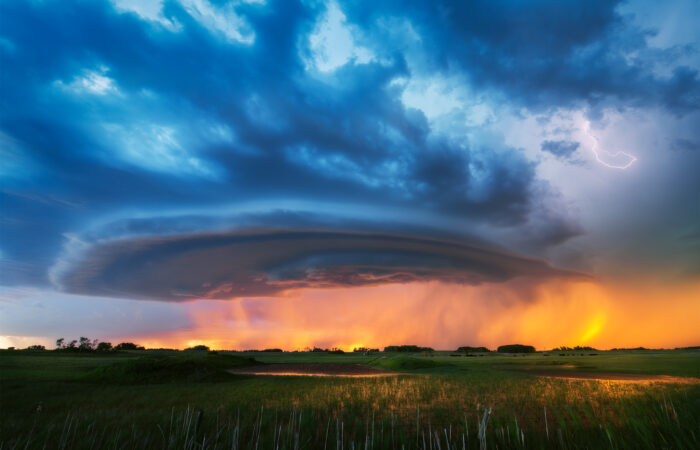 A storm brings a vibrant sunset to the Saskatchewan landscape